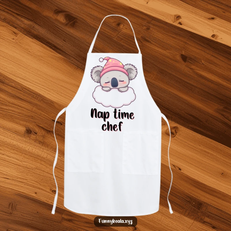 Funny sleepy koala chef apron showing a koala in a nightcap snoozing on a fluffy cloud, bringing sleepiness to the kitchen.