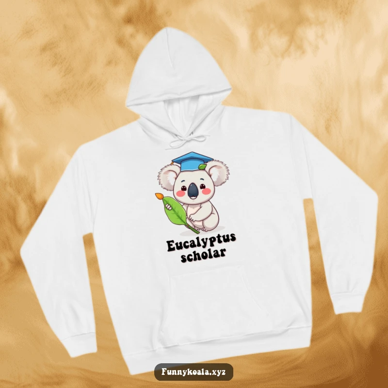 Funny koala graduation hoodie featuring a happy koala wearing a tiny cap and waving a eucalyptus leaf, representing academic triumph.
