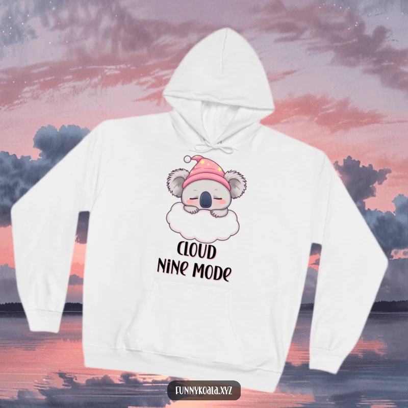 Funny sleepy koala hoodie featuring a koala in a nightcap peacefully napping on a fluffy cloud, ideal for cozy wear.