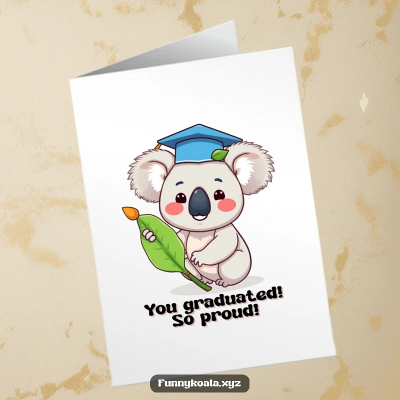Funny Free Printable Congratulations Card: Happy koala in graduation cap waves eucalyptus leaf, celebrating graduation success.