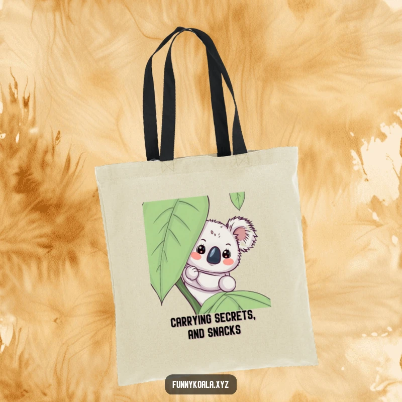 Funny koala tote bag showcasing a curious koala peeking from behind a lush leaf, perfect for carrying treasures with a smile.